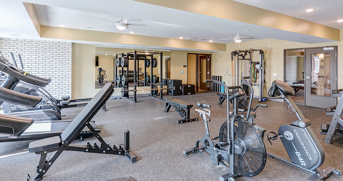 the crossings community room with fireplace and pool table