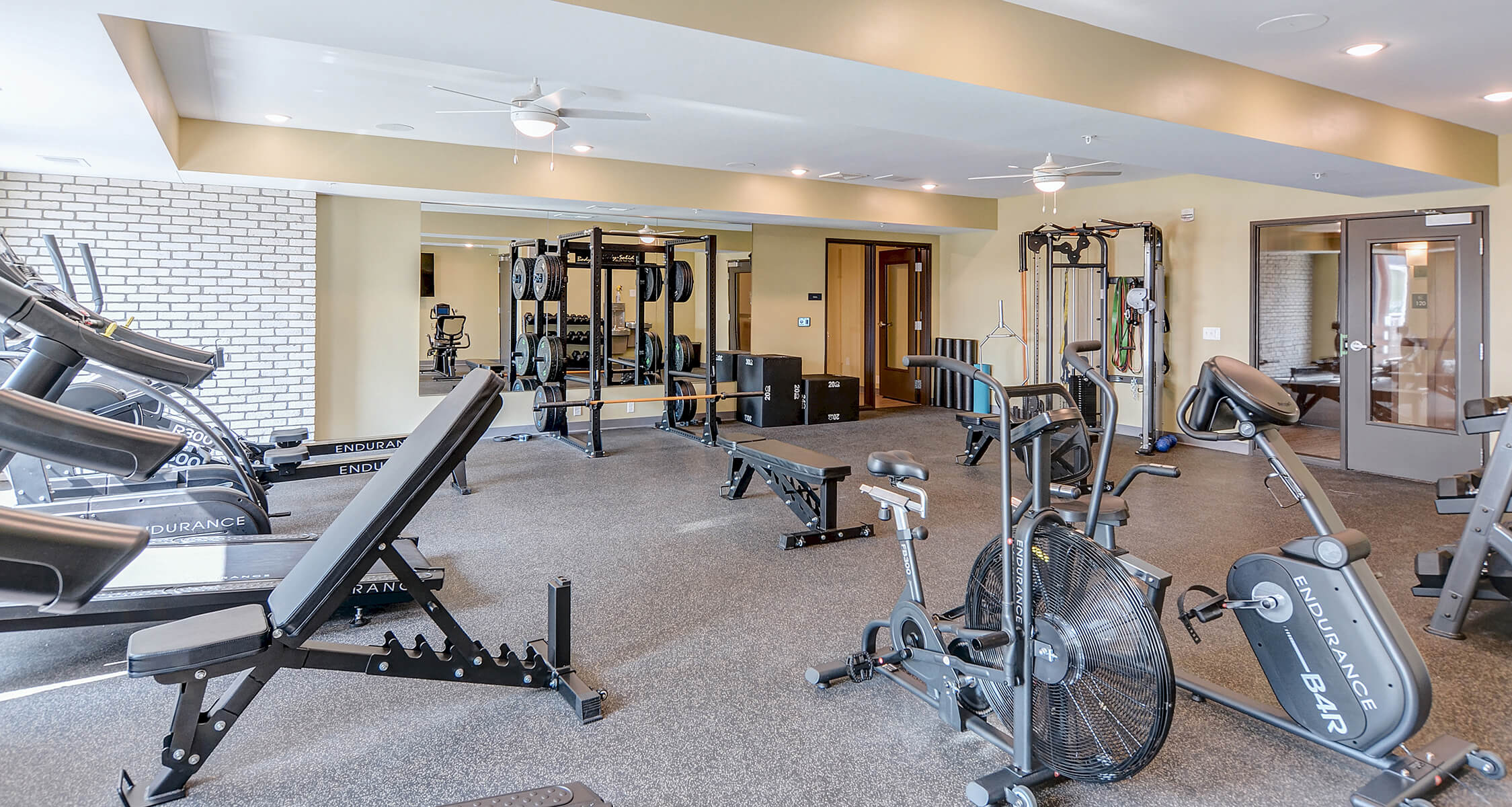 the crossings community room with fireplace and pool table