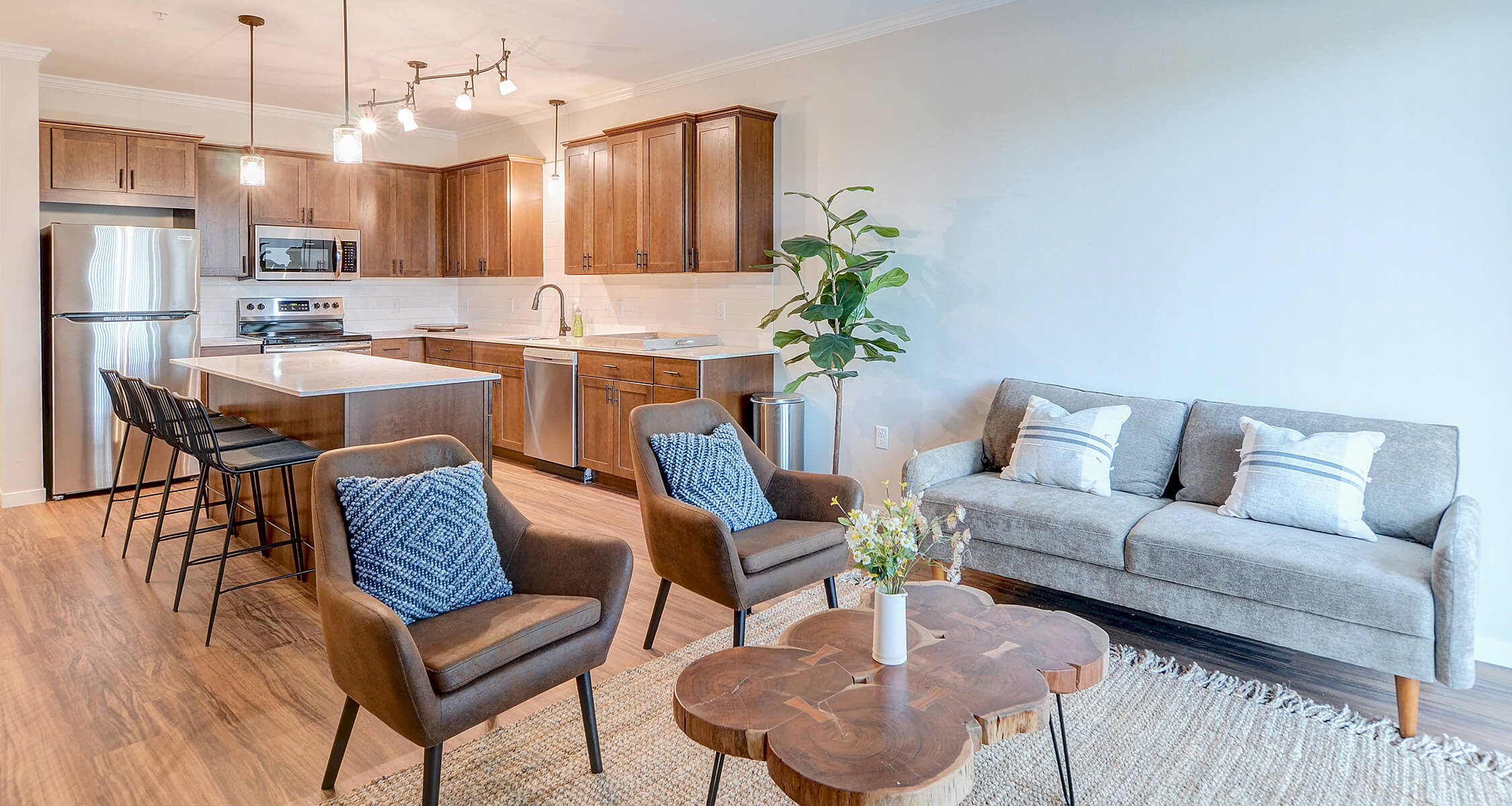 an apartment living room and kitchen